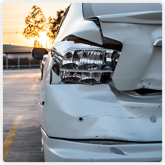 Damaged car rear with broken taillight.
